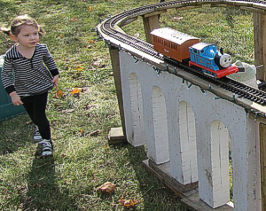 A young visitor following Thomas around the track.
