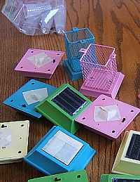 Party-colored lamps with the LEDs and solar panels masked off. Click for bigger photo.