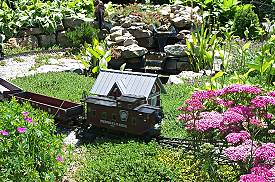 The Walther's station surrounded by Acre Sedum. In front are Finger Geraniums and a dwarf Yarrow. Click for a bigger picture.