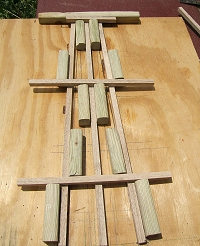 As you can see in this photo, I originally designed this jig to do a four-post bent, but then converted it to an unprototypical three-post bent for a children's railroad. Click for bigger photo.