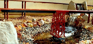 A PVC trestle supports a 'deck' bridge reinforced with aluminum. Click for bigger photo.