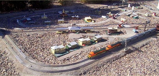 This is the Copper Creek Village section of Fred's railroad.  You can see that he as adapted indoor O gauge principles and products for his O Gauge Outdoors railroad.