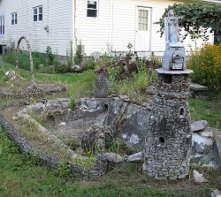 The original fishpond, with a windmill at one end, and a statuary-bearing lighthouse at the other. Click for bigger photo.
